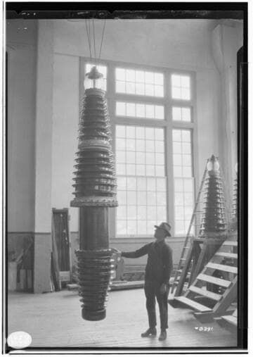 220kV Bushings from factory to service at Big Creek. Man standing by new bushing