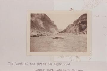 Upstream in Cataract Canyon from approximately Mile 201.9. The rapid is #23 on the Chenowith-Hoyt list. Photo sent by Adloph G. Sutro. Back of print is captioned: Lower part Cataract Canyon
