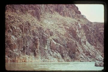 The left bank of the river at the head of Separation Rapid where Powell got rimmed and claimed he would have dropped 400 ft. into the river had he loosed his hand-hold. The fraud is obvious