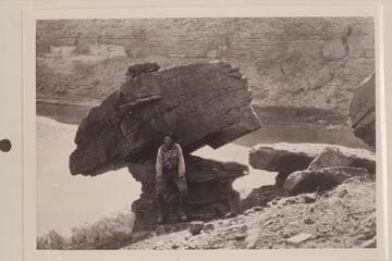 Robert N. Allen beside balanced rock. San Juan River to left, Colorado River to right. Used as Complainant's Exhibit No. 388 in River Bed Case