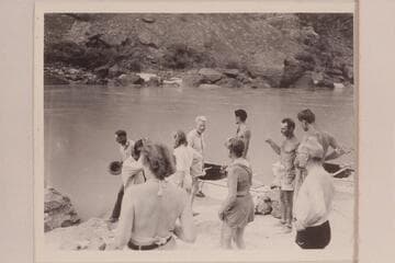 On beach on right bank at head of Lava Falls: John Riffey; Kent Frost; Marie Saalfrank; Zoe Desloge; Margaret Marston; Garth Marston; Norm Nevills; Joe Desloge; Randall Henderson with black trunks