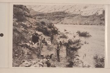 Camp below Mendenhall Loop where flood drove us out. Loper with bedding. Left to right: Loper; Hyde; Trimble; Christensen; Blake; Miser