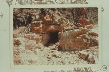 Horizontal shaft about 25 feet deep at Bass Asbestos Mine in Hakatai Canyon. Note hand tools at left