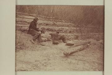 Camp during boat trip from Greenriver, Utah, to the Junction and return. Probably Arthur G. McCormick in the photo