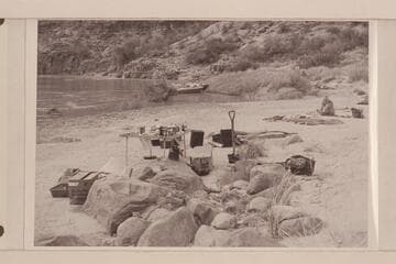 Camp gear and sleeping quarters at Mile 192; boat mooring. Masland is breaking out of the sack