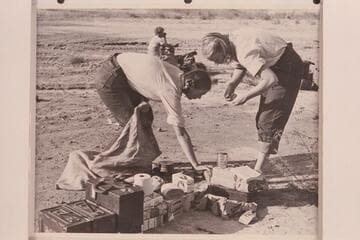 Anne and Zoe Desloge clean up after breakfast at Pierces Ferry. Margaret Marston in background