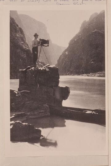 Emery Kolb photographing in the Grand Canyon near Bright Angel Creek. One of Dave Rust's folding canvas boats is at right