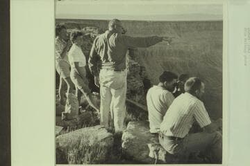 L. Miller and Gene Segerblom get a report on the river party from chopper pilot Lynn Roberts. Buck Farm Point
