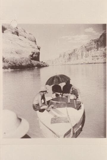 Nevills 1940 party in Glen Canyon. Del Reed sits on the gunwale of the "Joan."