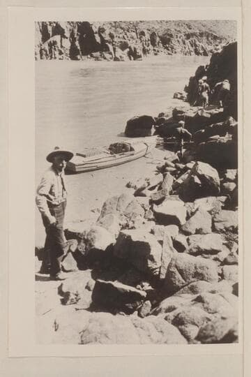 Photo No. 58, Lint album. Foot of Bass Trail. Mr. Bass at left. The pack train arrived about noon of 1923, Sep. 02. The river was rising