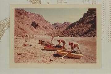 Packing the Sportyaks at camp at Mile 209.6. Rapid #6 is upstream