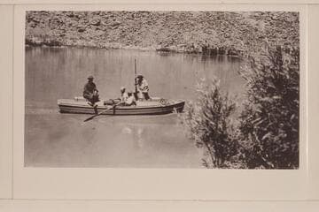 The "Grand" launched at Lees Ferry. The four boatmen are aboard. Left to right: Freeman, Lint, Blake, and E. D. Kolb. Lint album