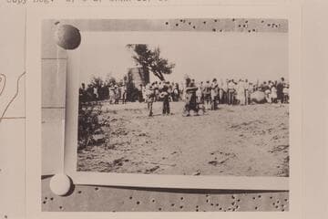 Townfolk of Green River, Utah, to watch the Eddy crew embark June 27, 1927. Two of the heavy boats copied from the Powell design are at right