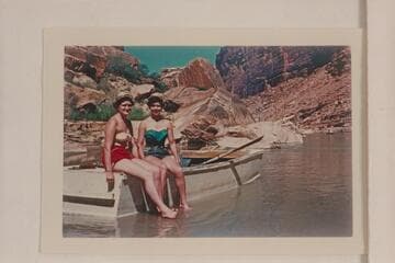 Lois Ross (wearing red shorts); Elaine Frost (green shorts). Students at Denver University. Short distance below Express Train Rapid section. San Juan River. Frost second trip